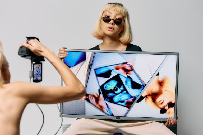 Photo of woman holding monitor